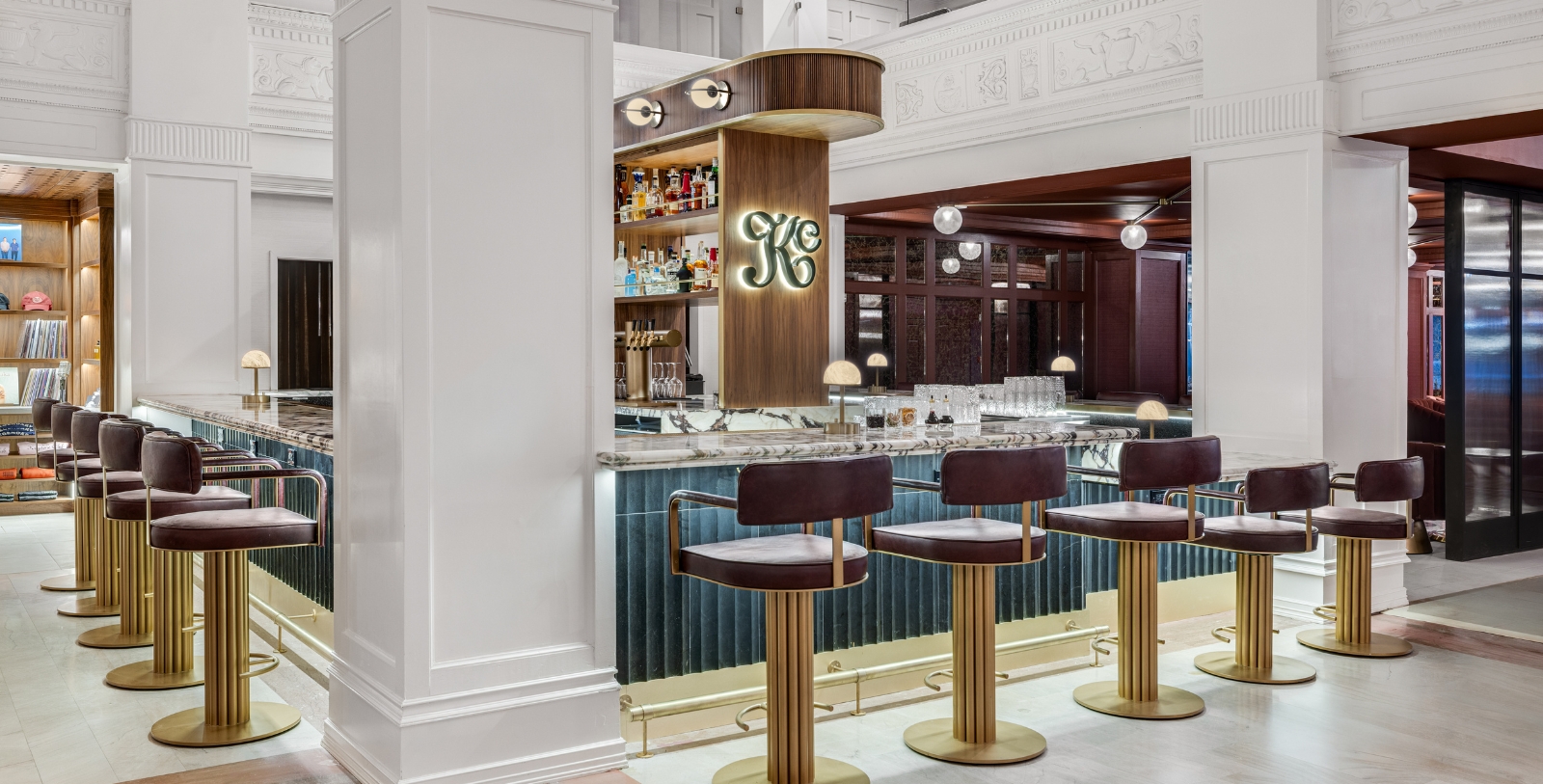 a bar with chairs and a counter