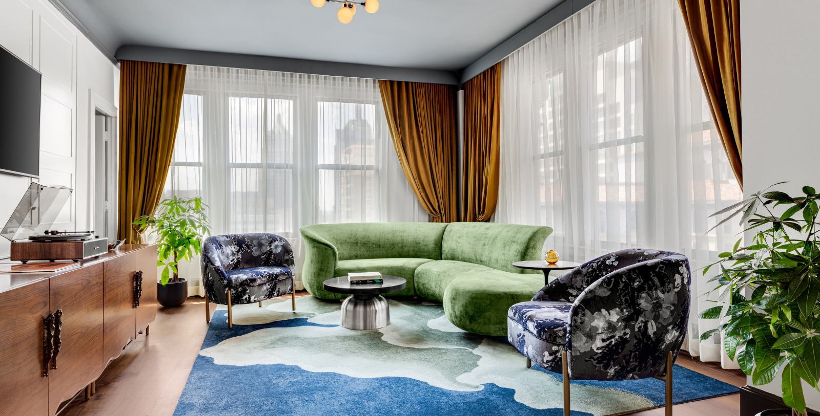 a living room with a couch and chairs