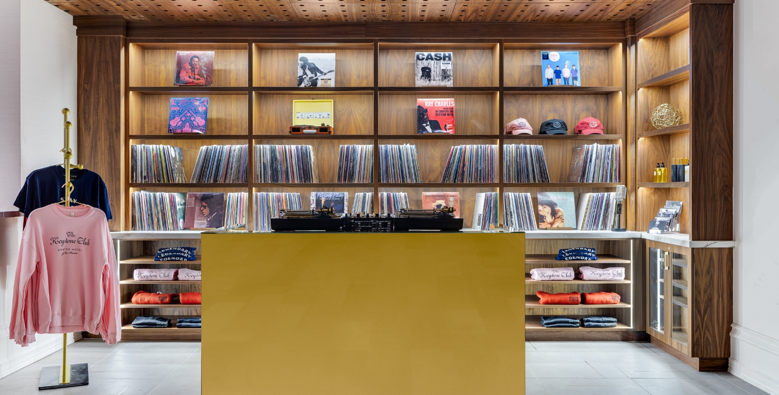 a record player on a record player desk in a store