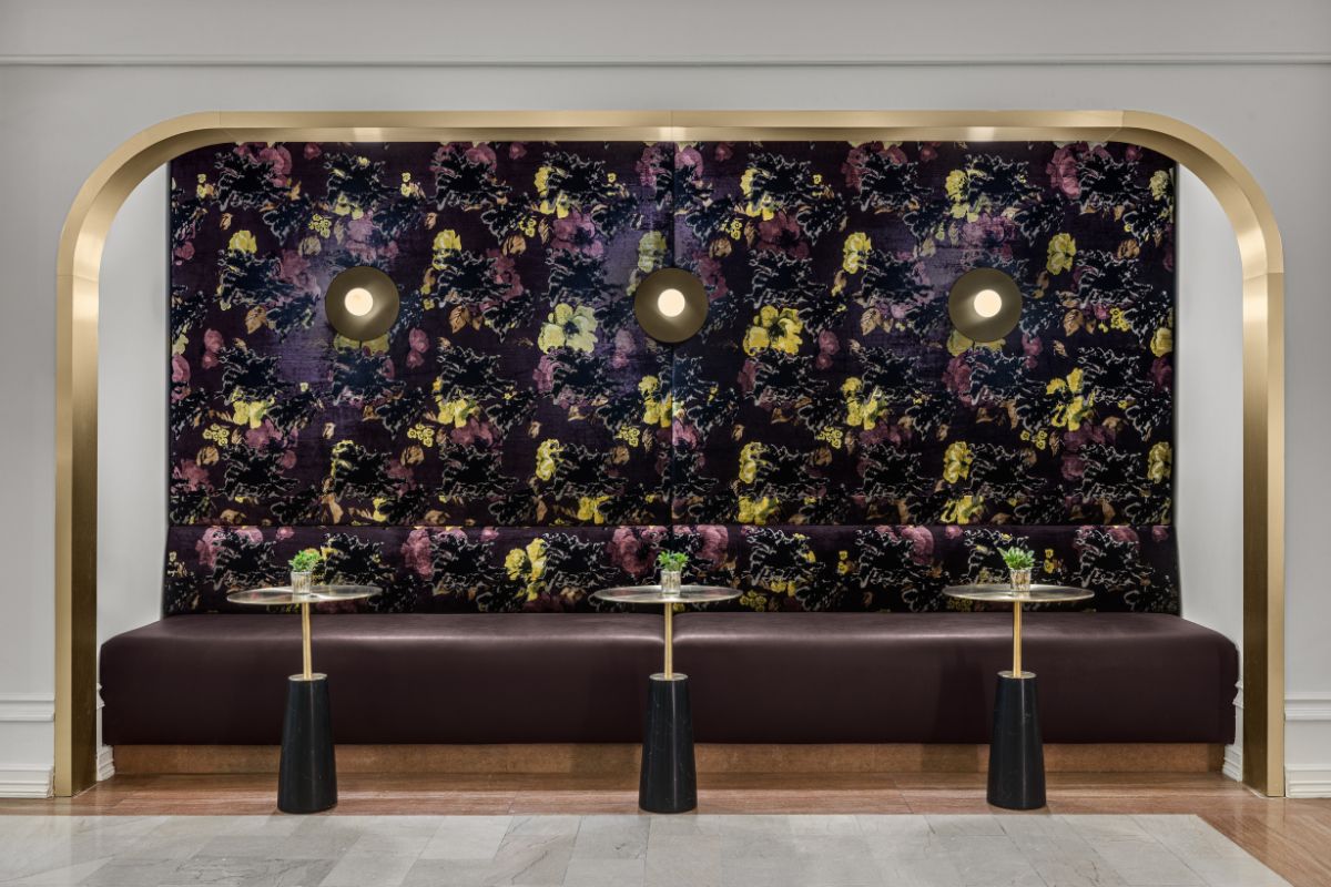 a long couch with a floral pattern on it