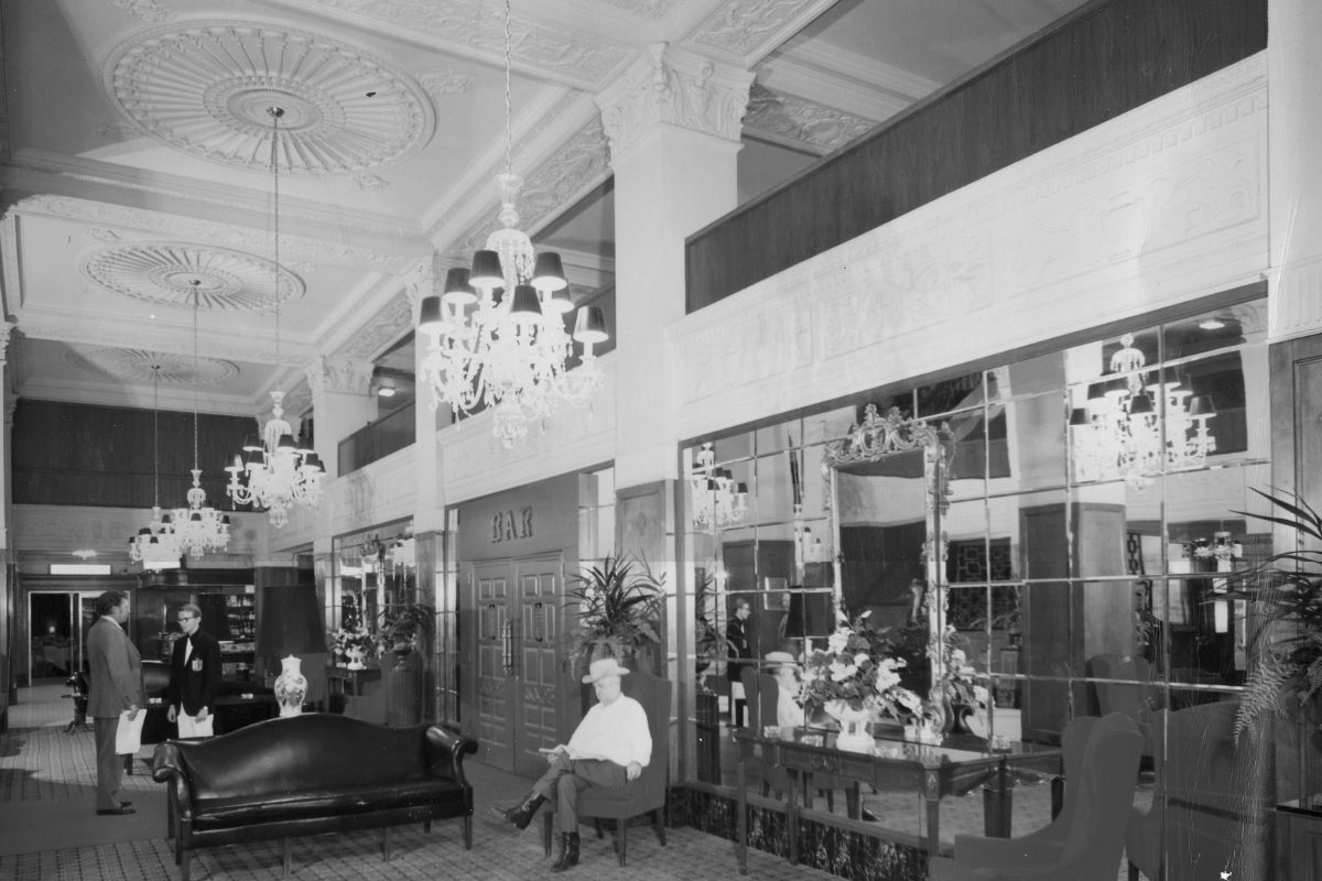 a man sitting in a chair in a lobby