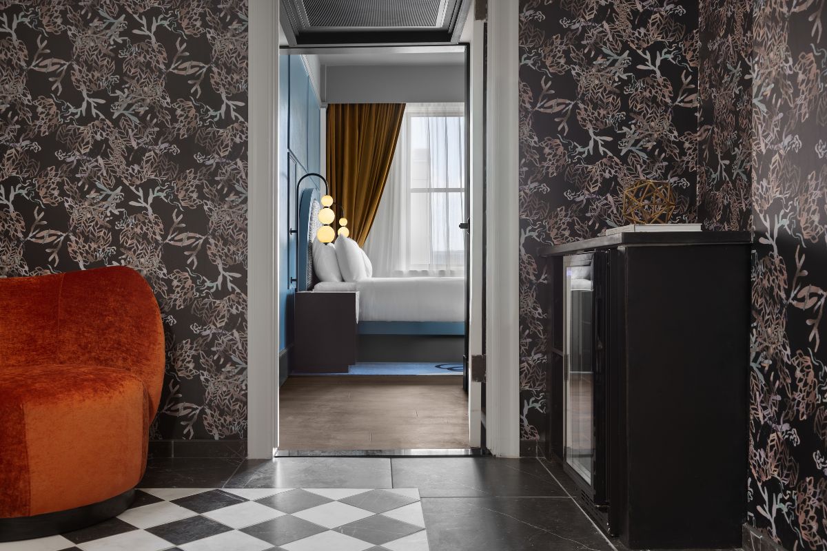 a room with a bed and a fireplace
