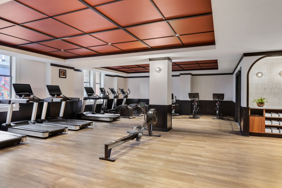 a gym with treadmills and exercise equipment