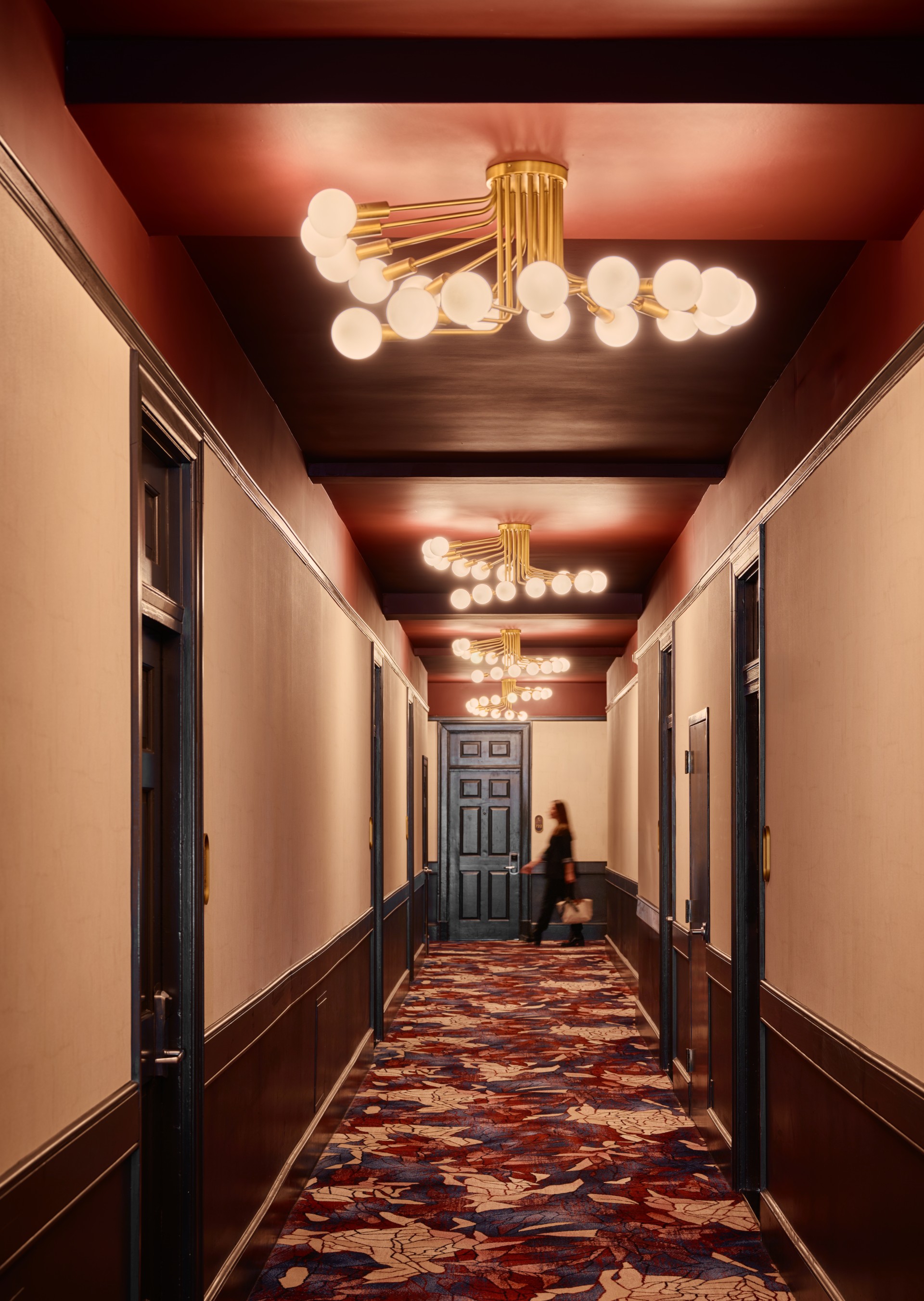 a woman walking in a hallway