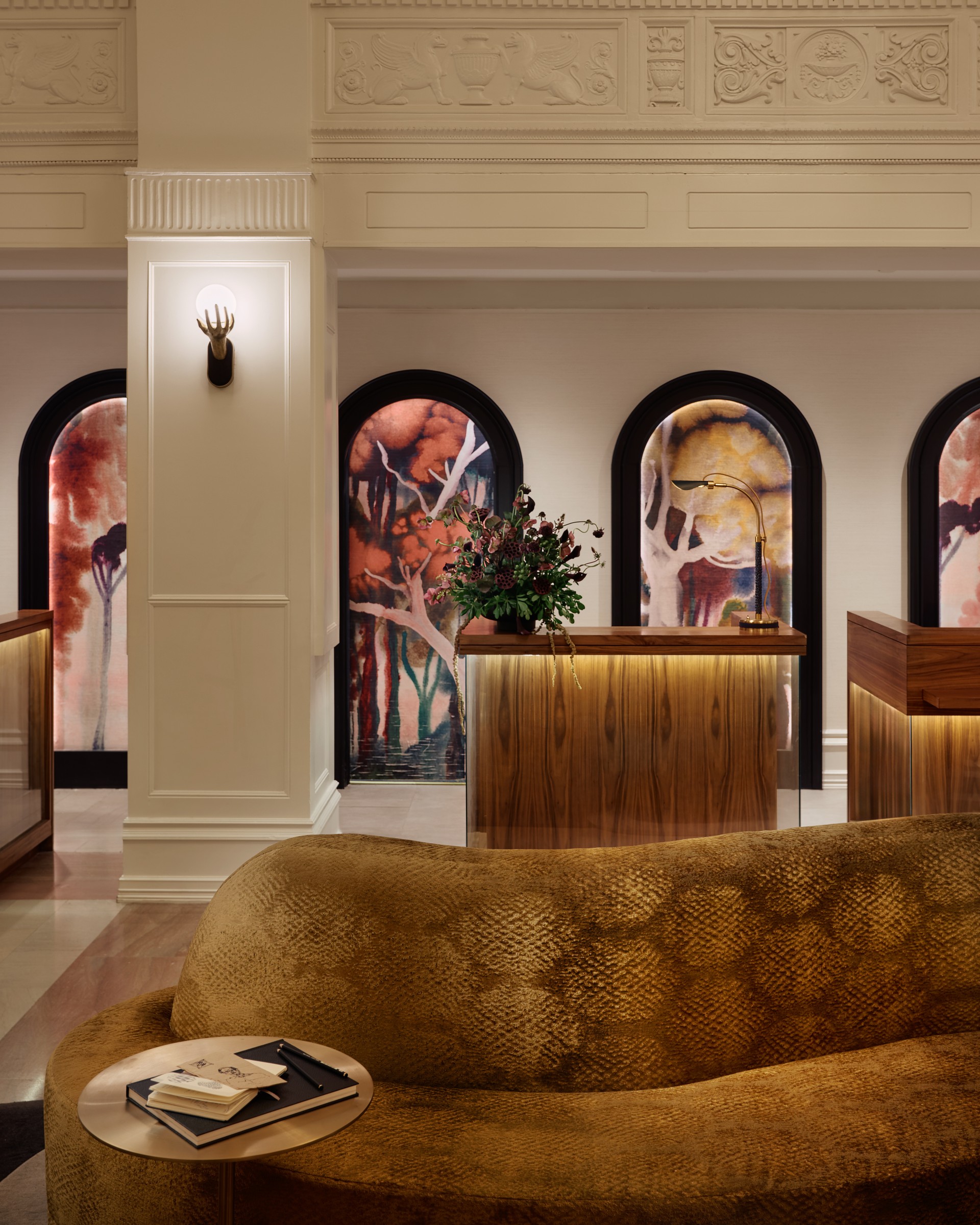a lobby with a couch and a table