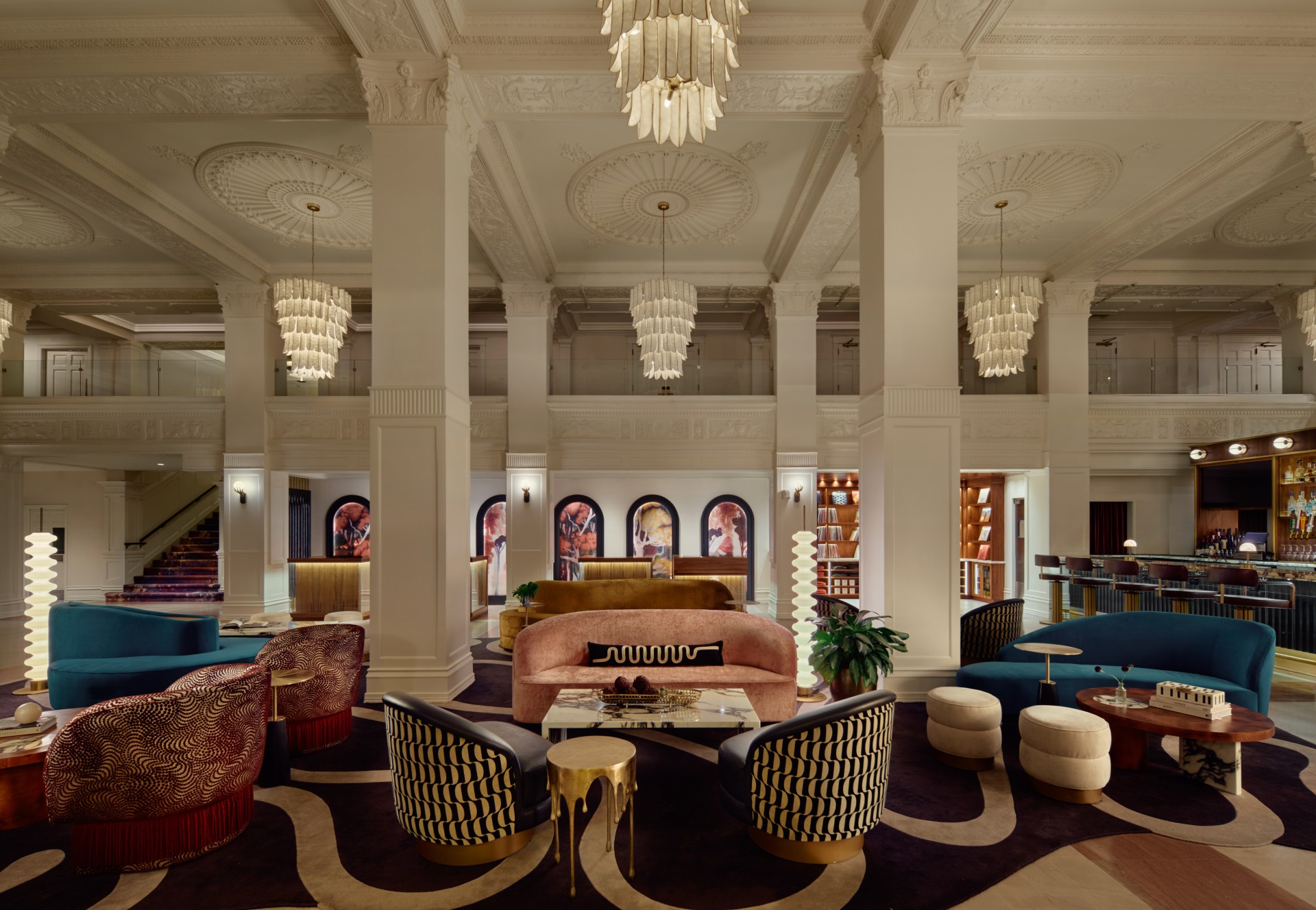 a large room with a large sofa and chairs