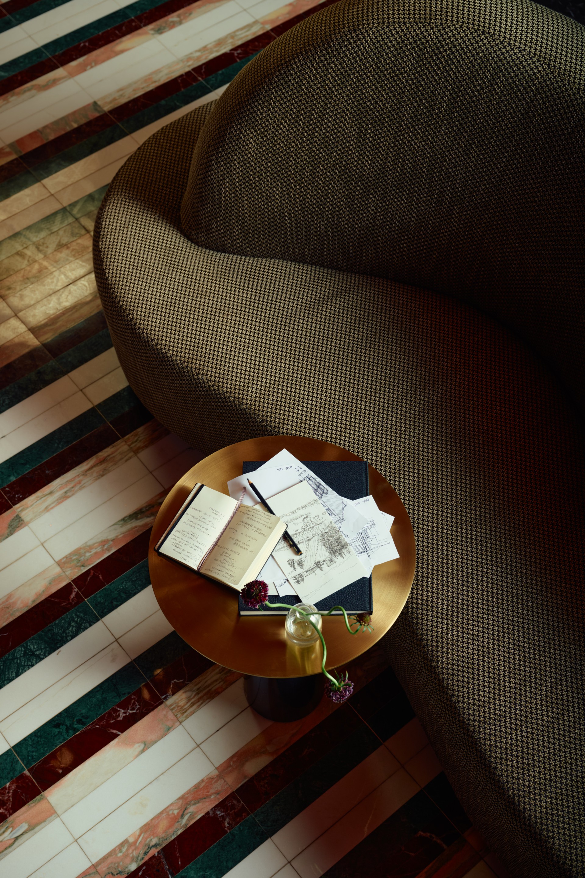 a table with papers and a pen on it