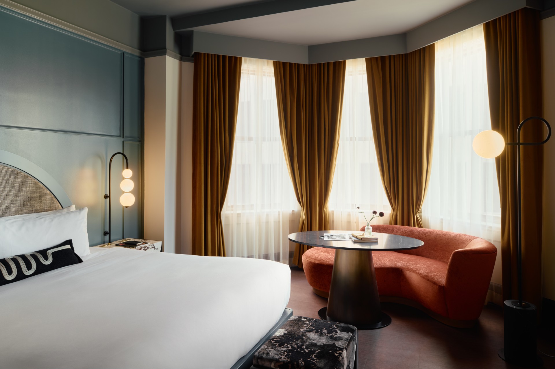 a room with a bed and a round table