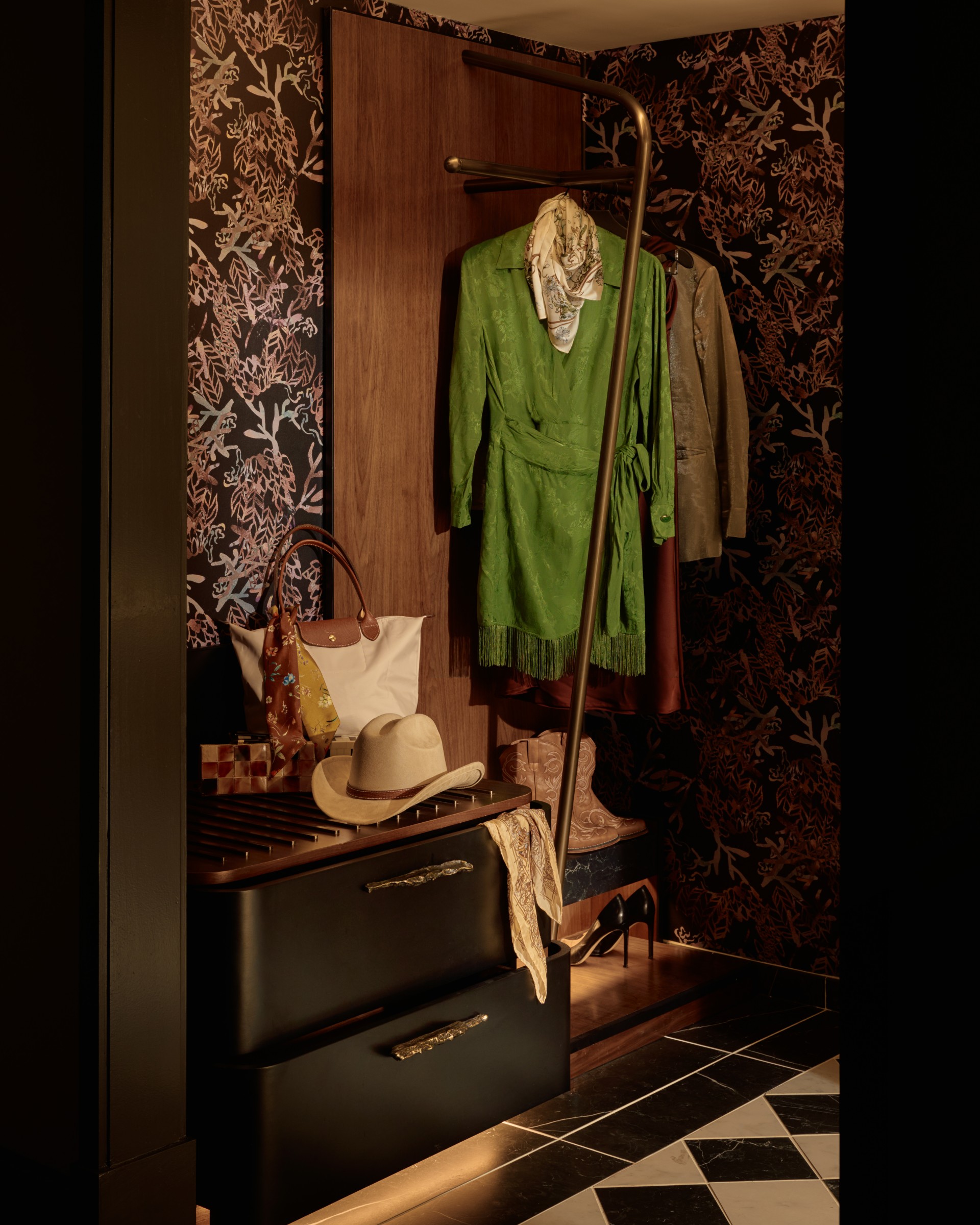 a closet with a hat and clothes on a swinger