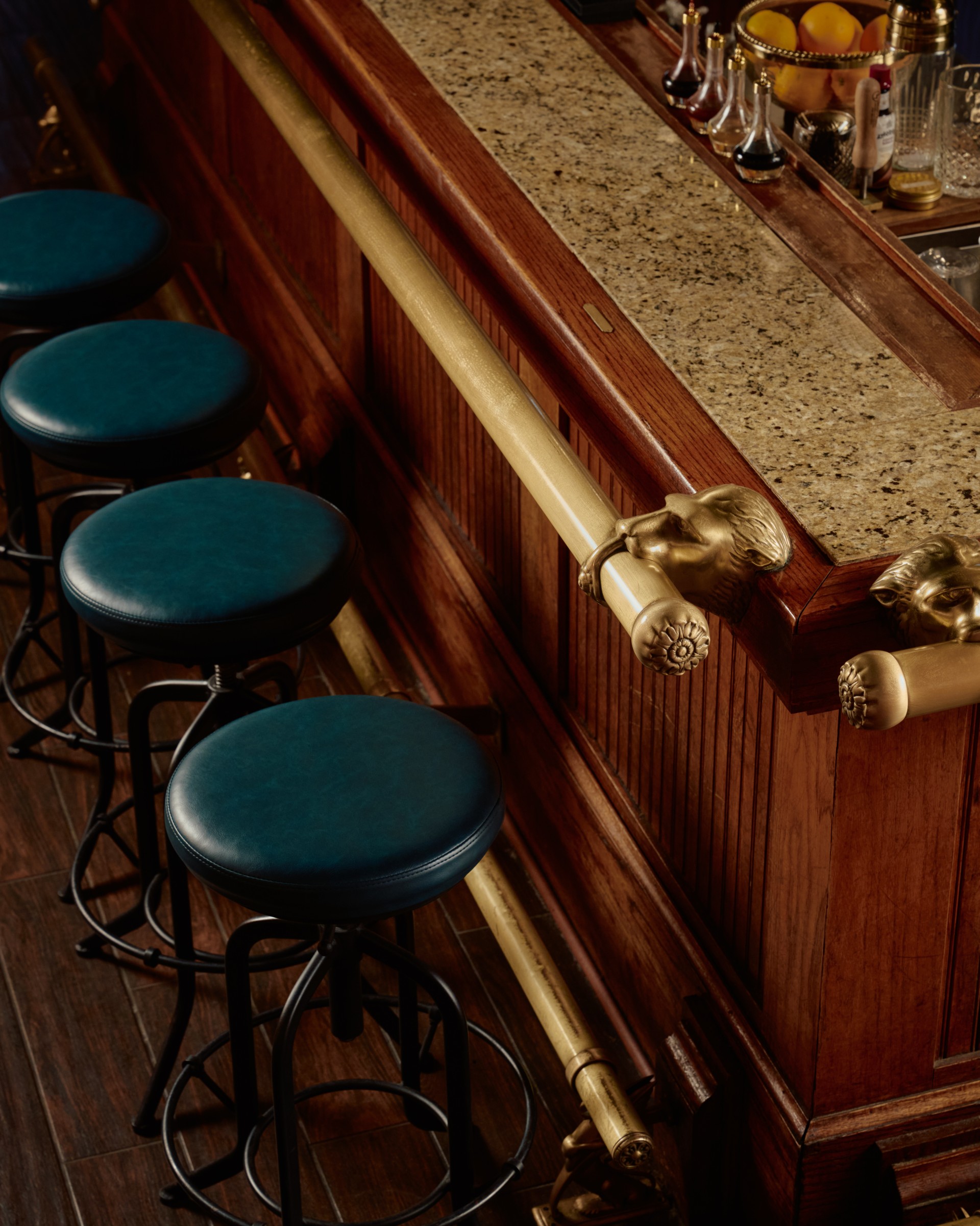 a bar with stools and a bar