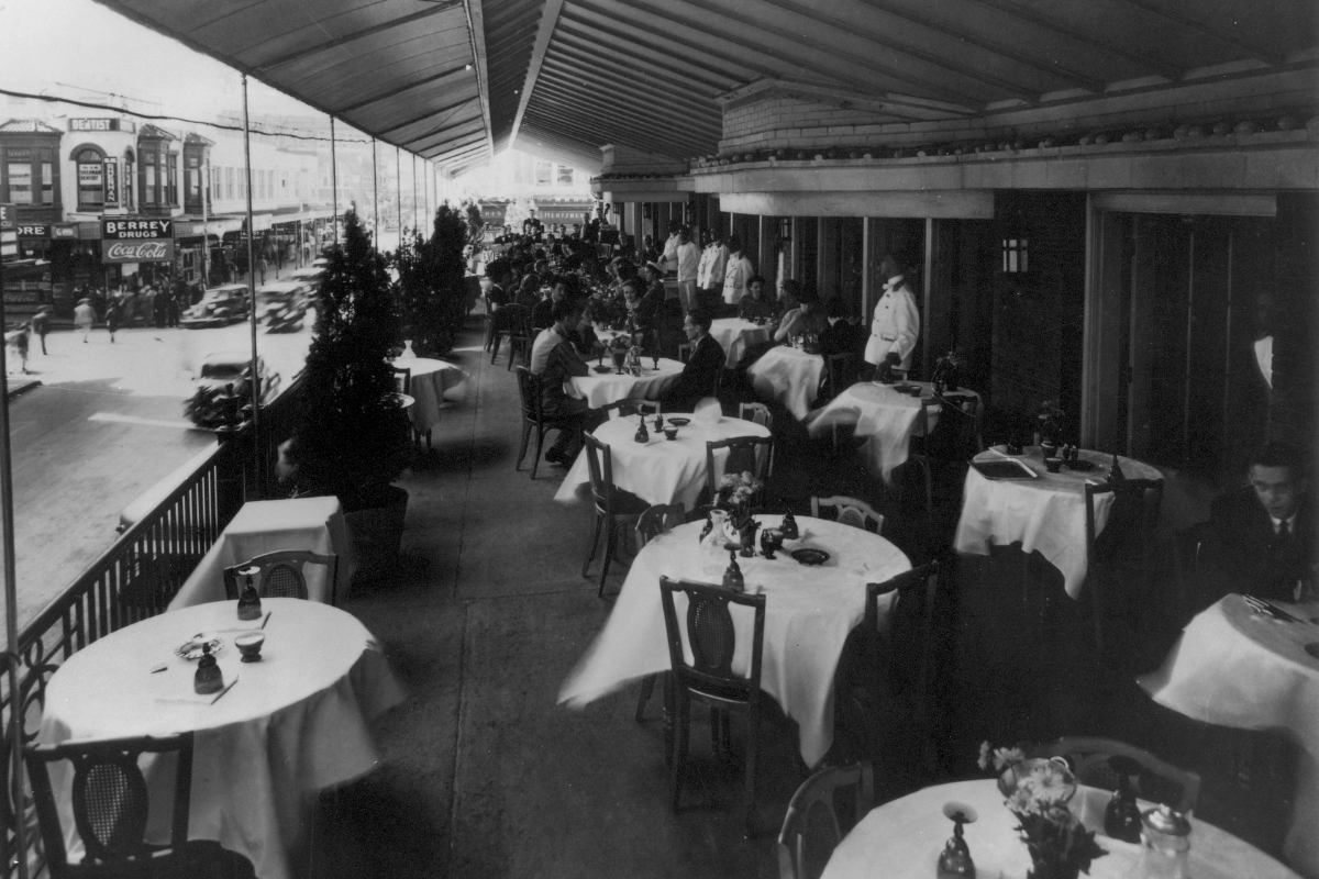 a group of people sitting at tables