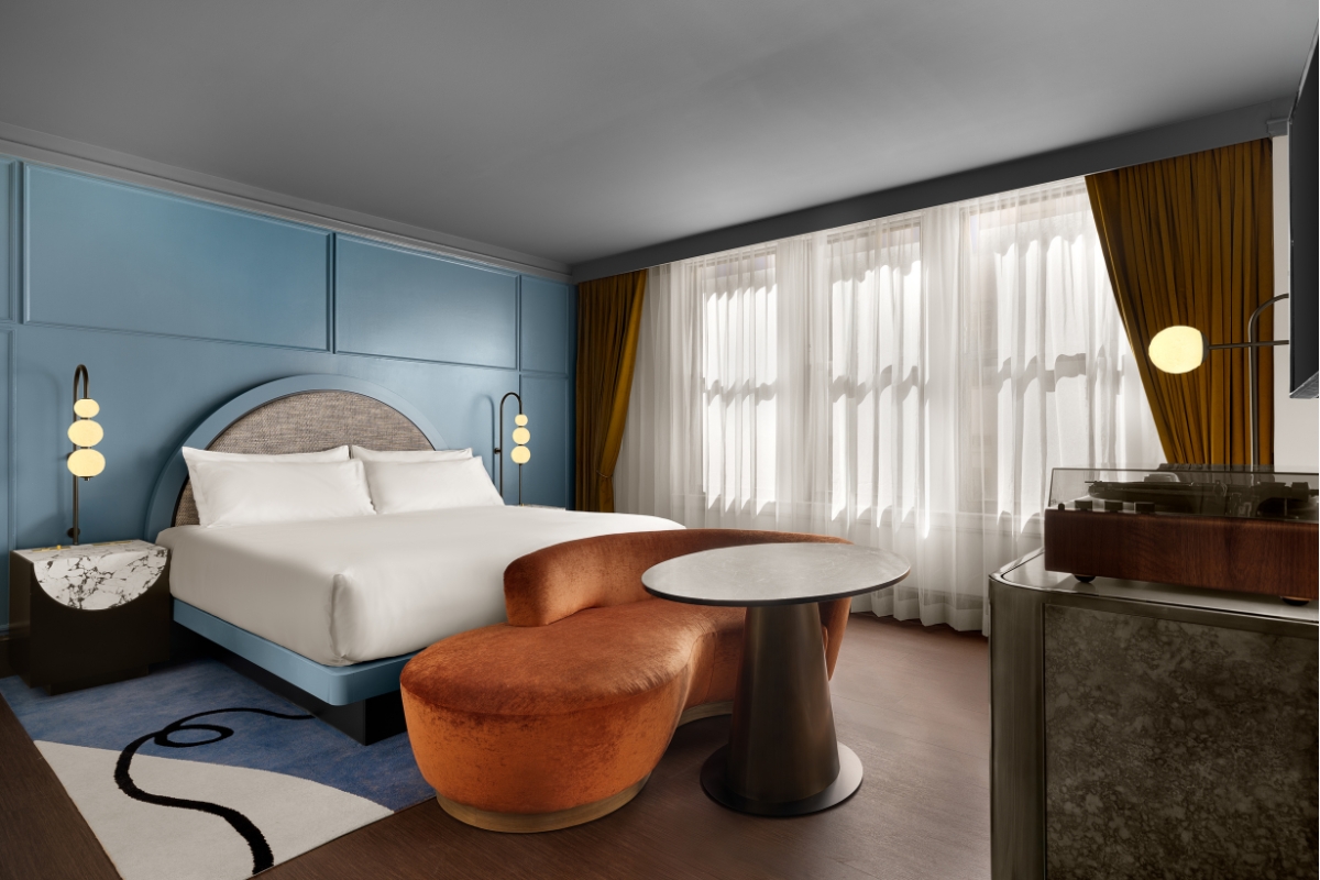 a room with a bed and a round table