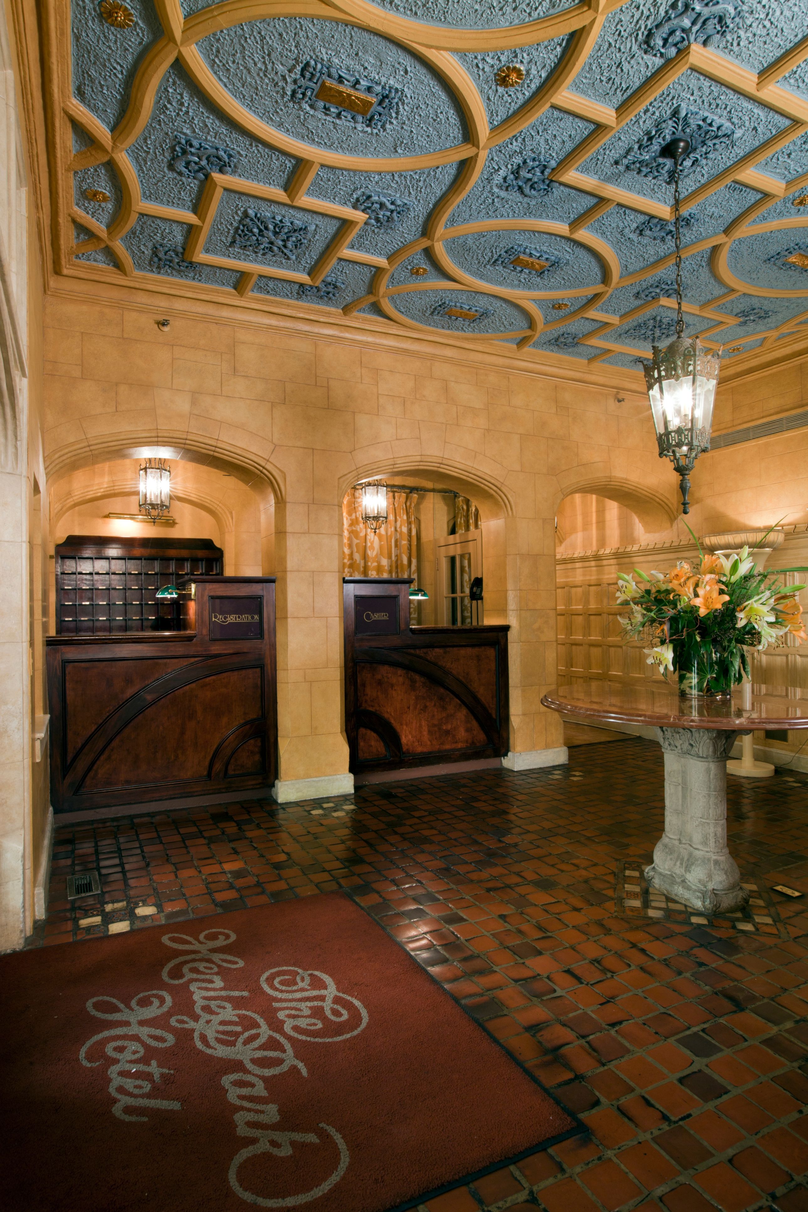 a lobby with a table and flowers