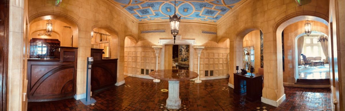 a room with a round table and a blue ceiling