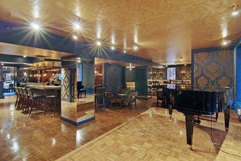 a room with a piano and a mirror