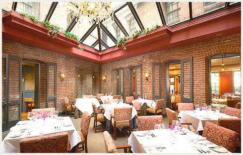 a restaurant with a glass roof