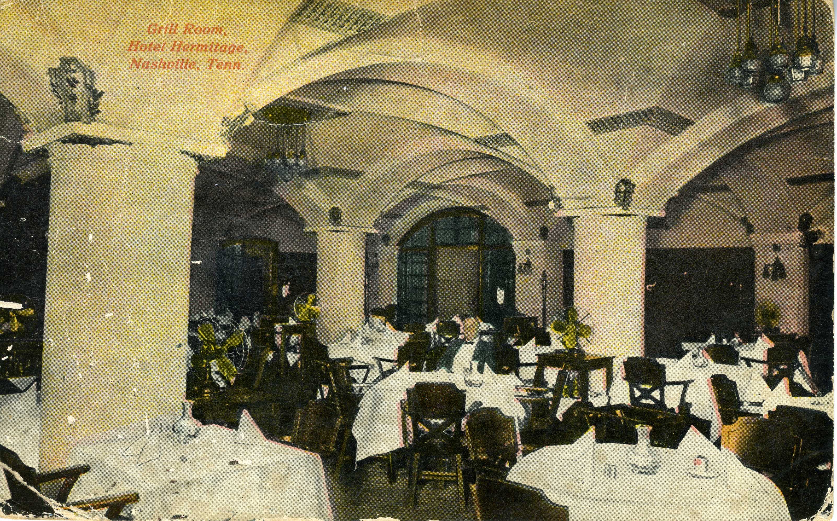 a group of people sitting at tables in a room