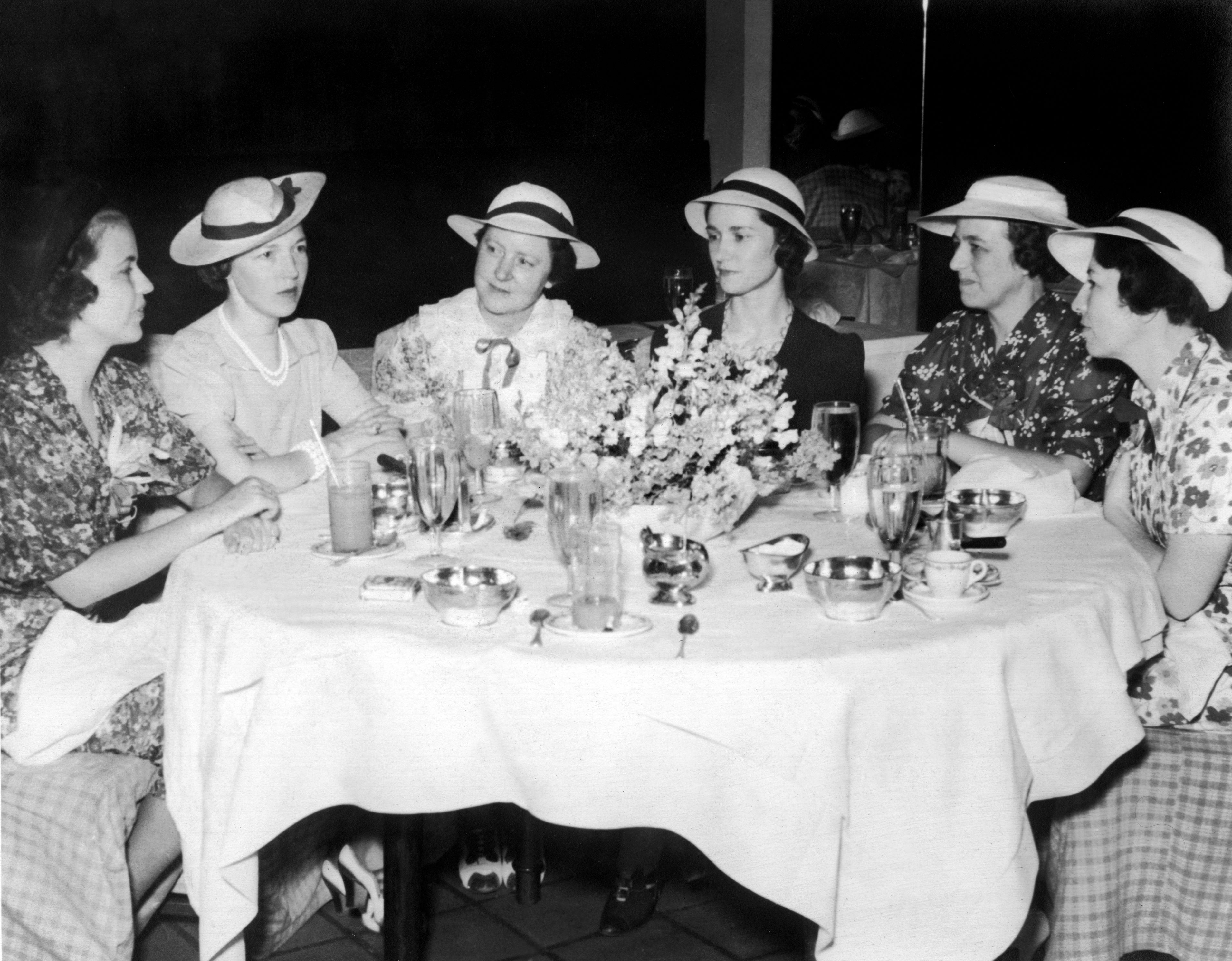 a group of women sitting around a table