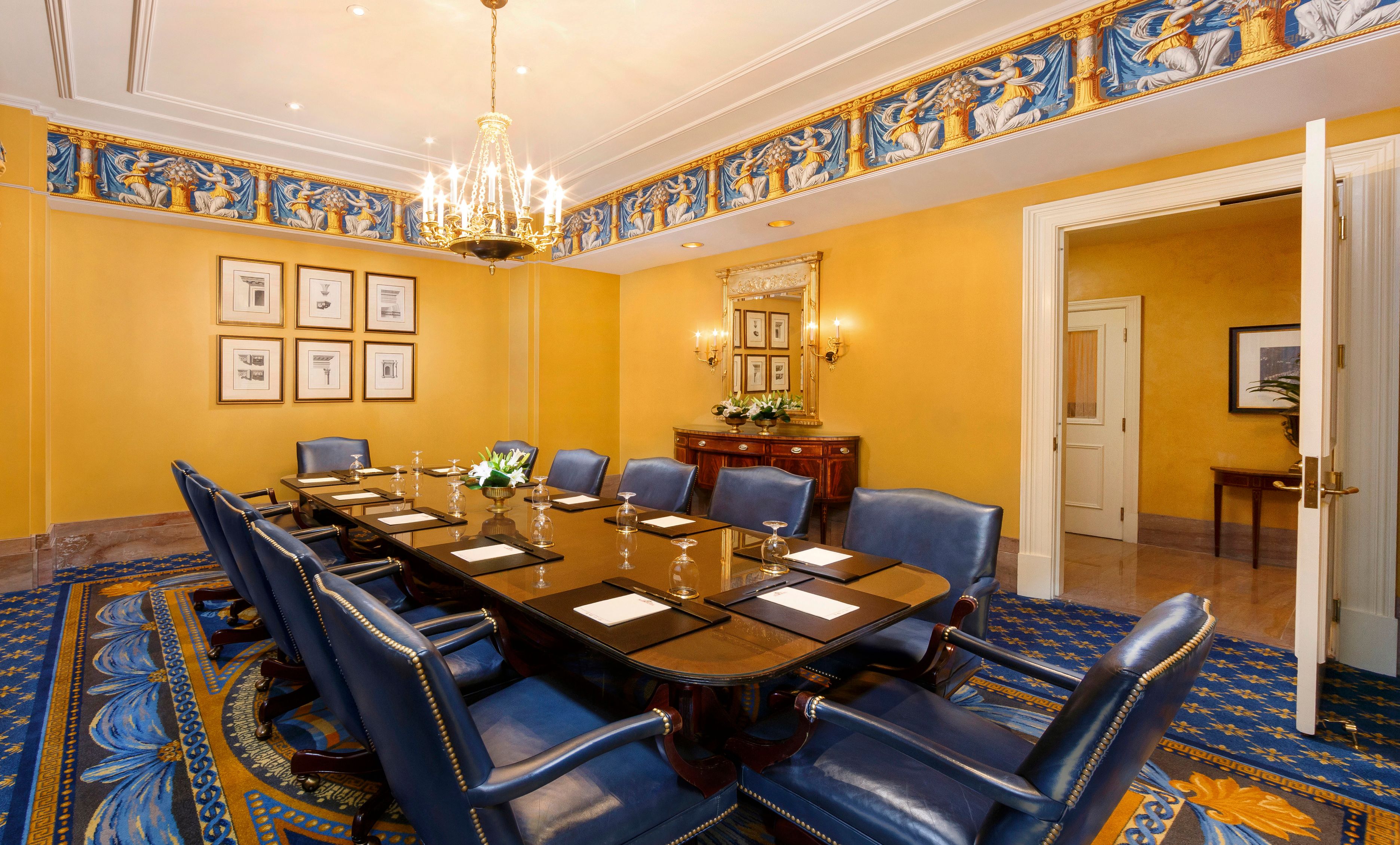 a conference room with a table and chairs