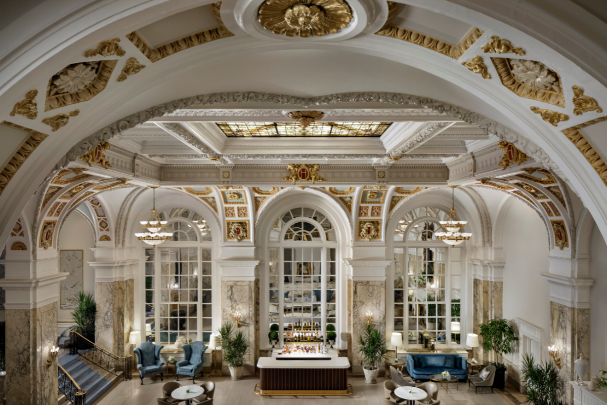a room with a bar and chairs