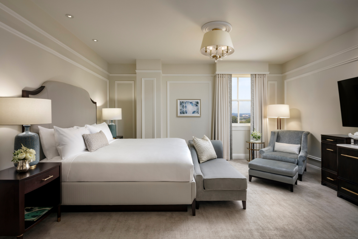 a bedroom with a bed and a couch