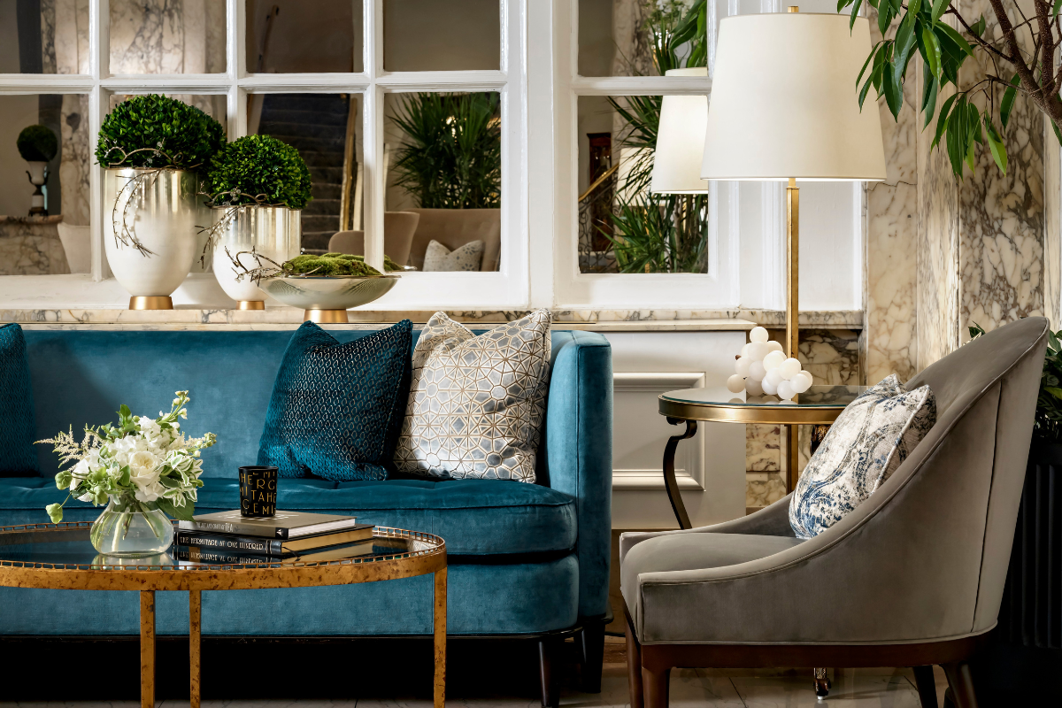 a living room with a blue couch and a coffee table
