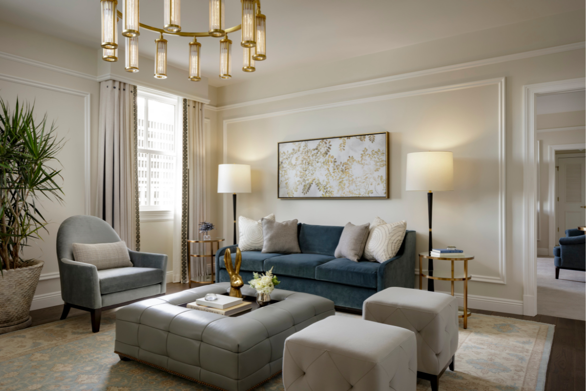 a living room with a couch and ottoman