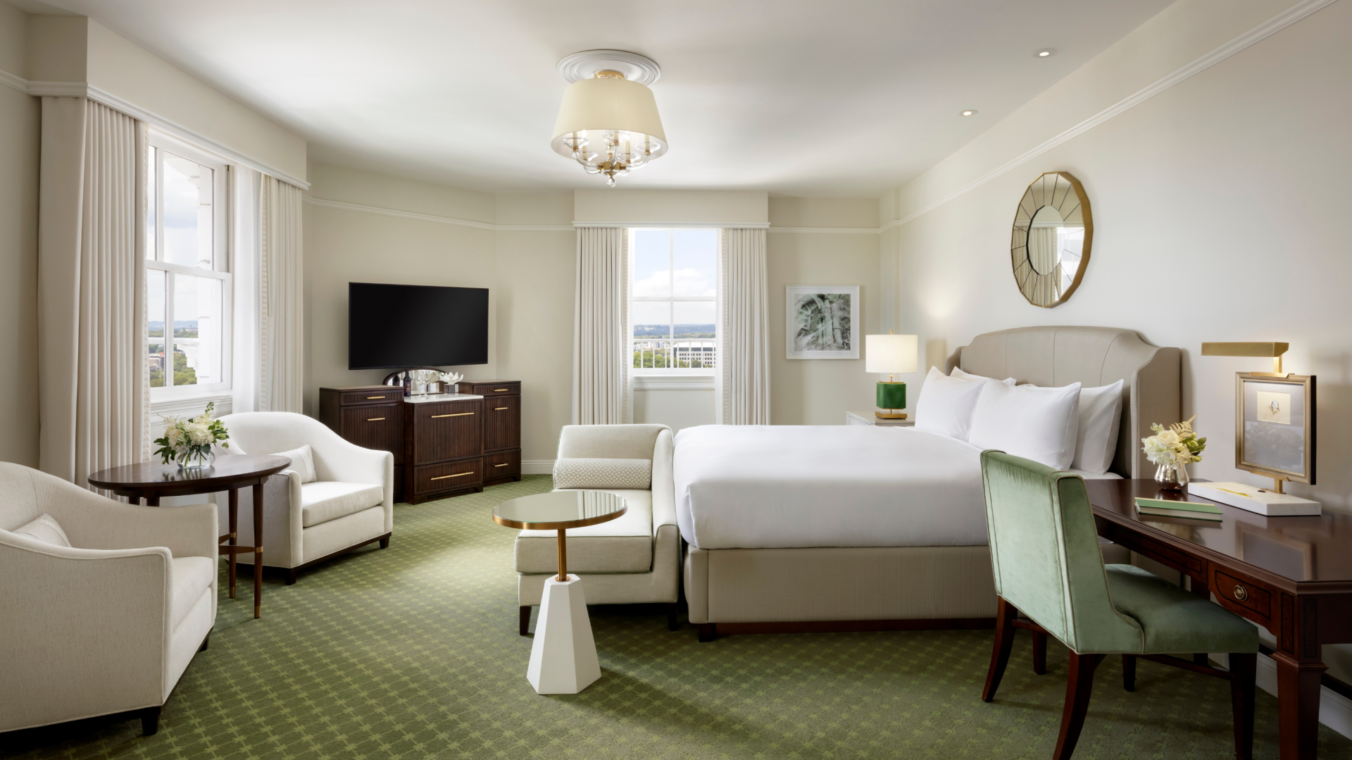 a room with a bed and a television