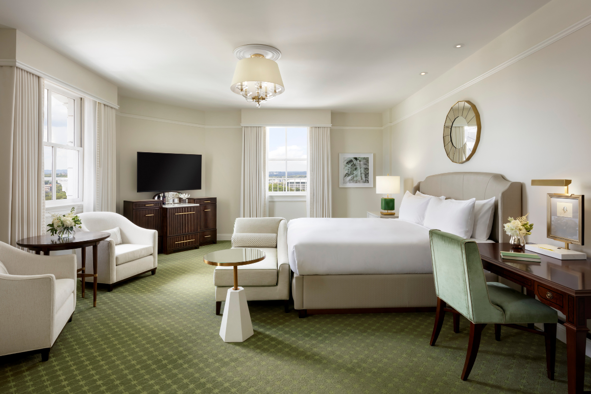 a room with a bed and a television