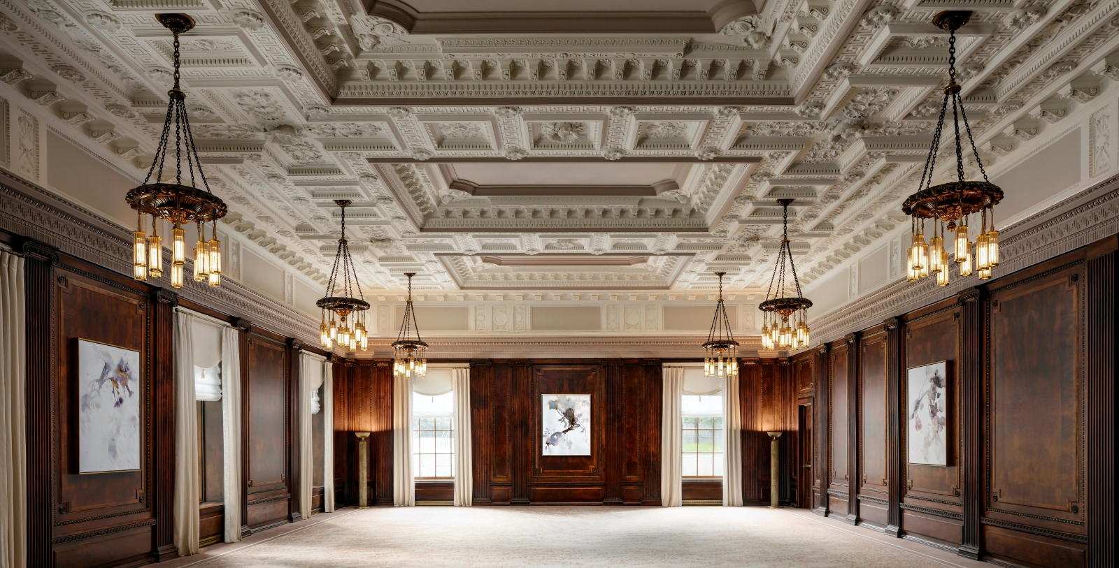 a room with a ceiling and chandeliers