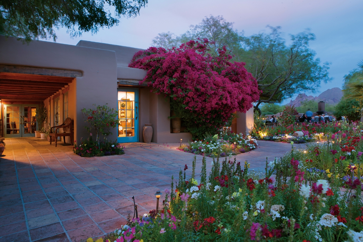 a house with flowers and a garden