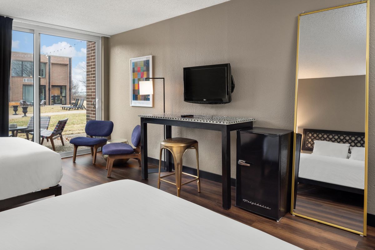 a room with a television and a mirror
