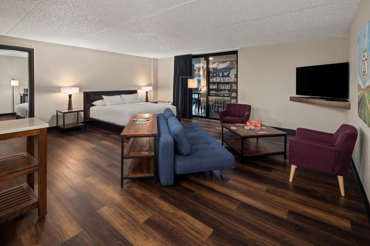 a room with a bed and a tv