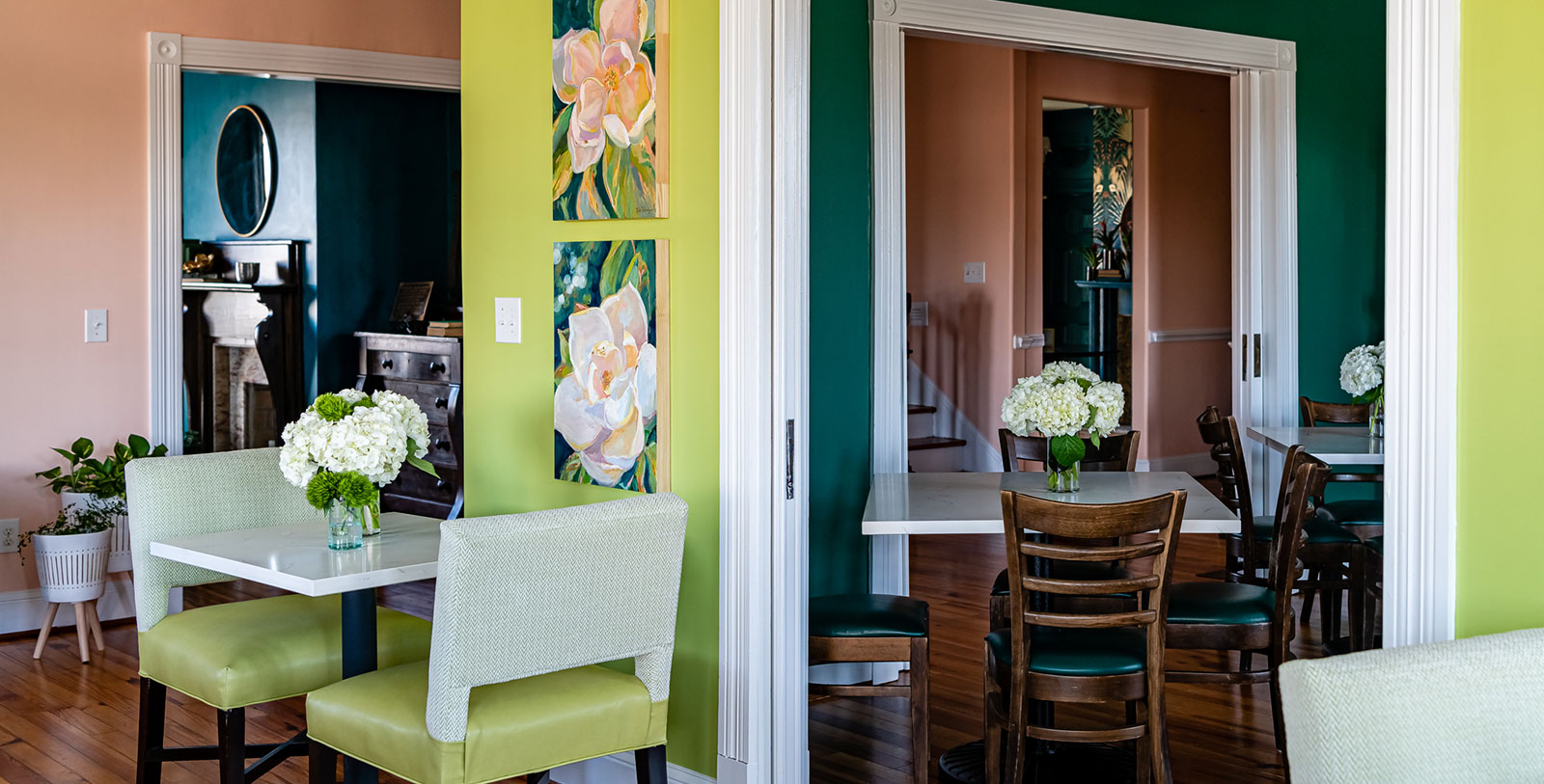 a dining room with chairs and table