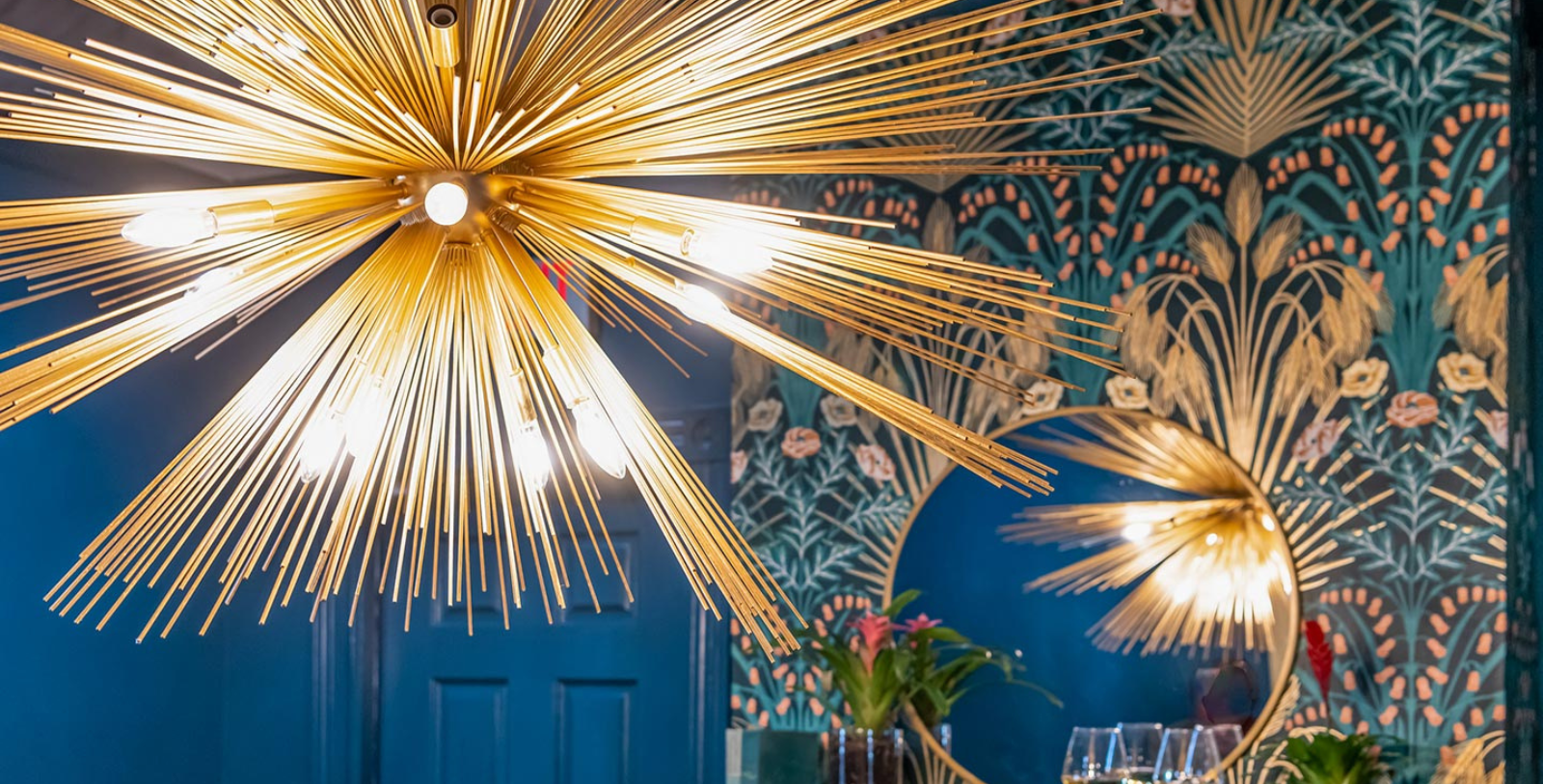 a chandelier with a light fixture from the ceiling