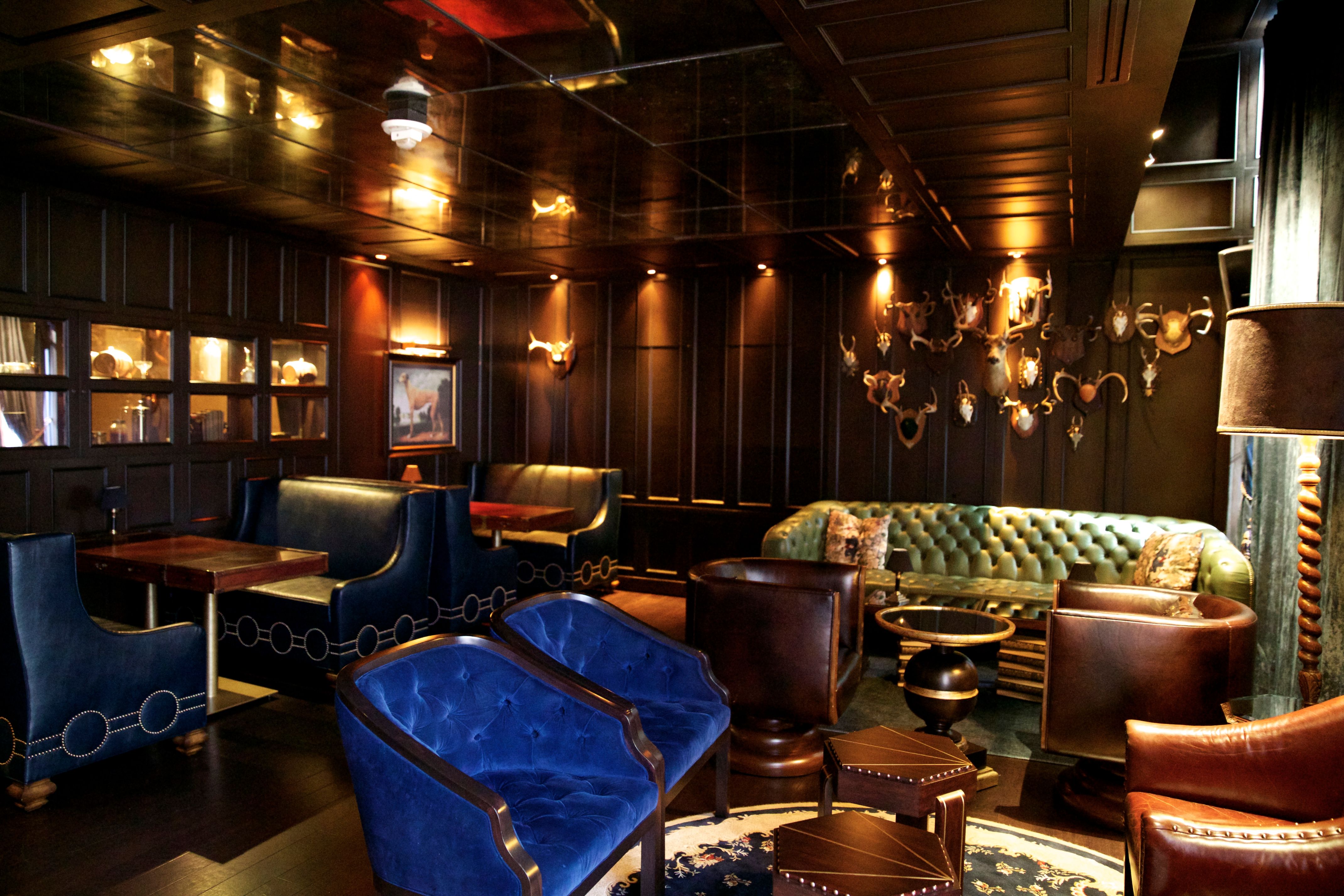 a room with a couch and tables