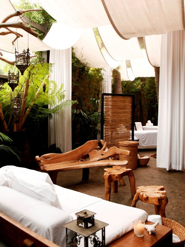 a room with white curtains and white furniture