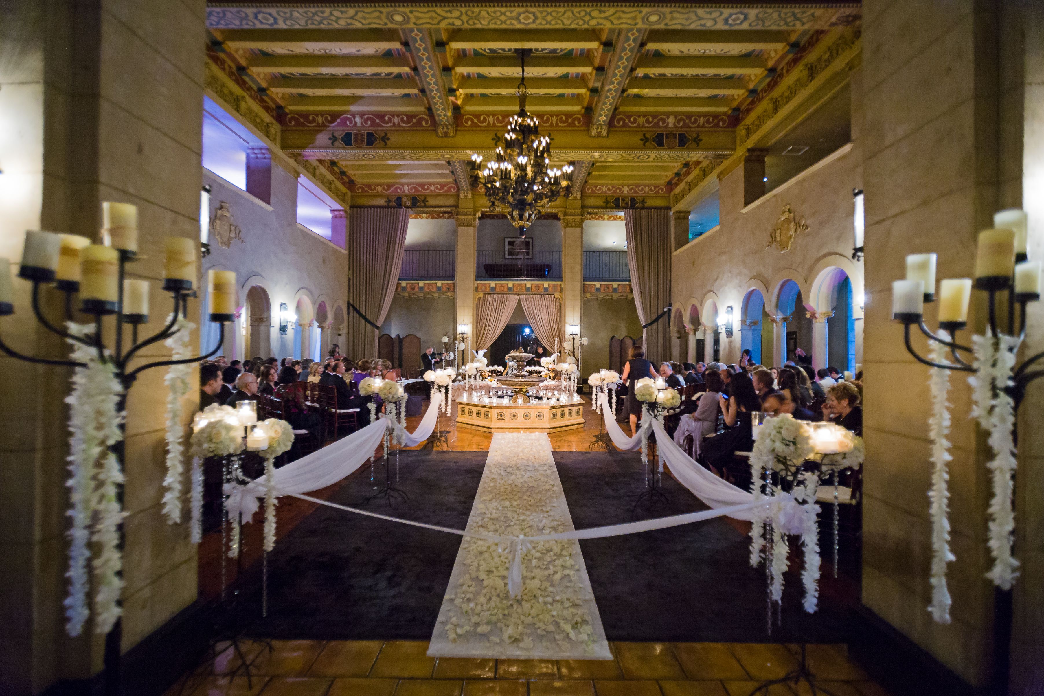 a room with a large table with tables and chairs