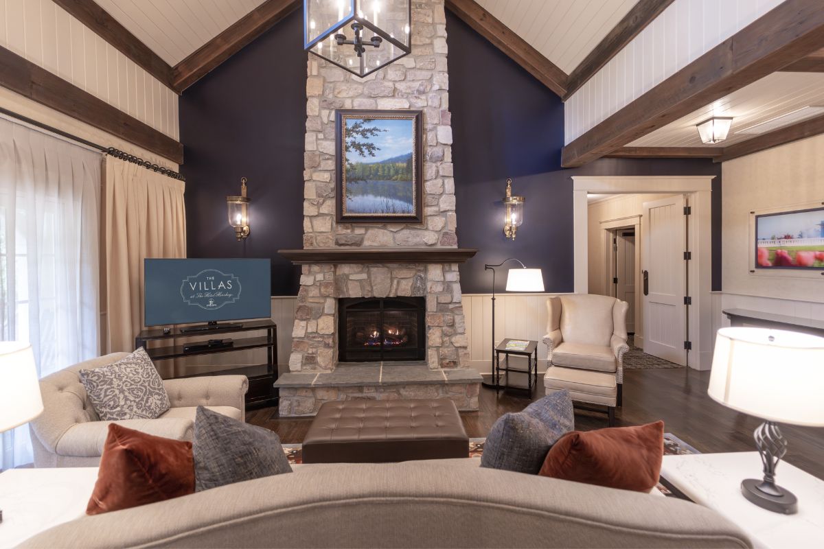 a living room with a fireplace and a couch