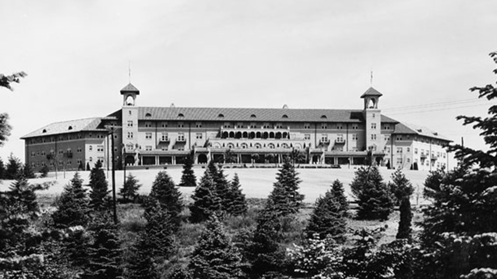 a large building with trees in the background