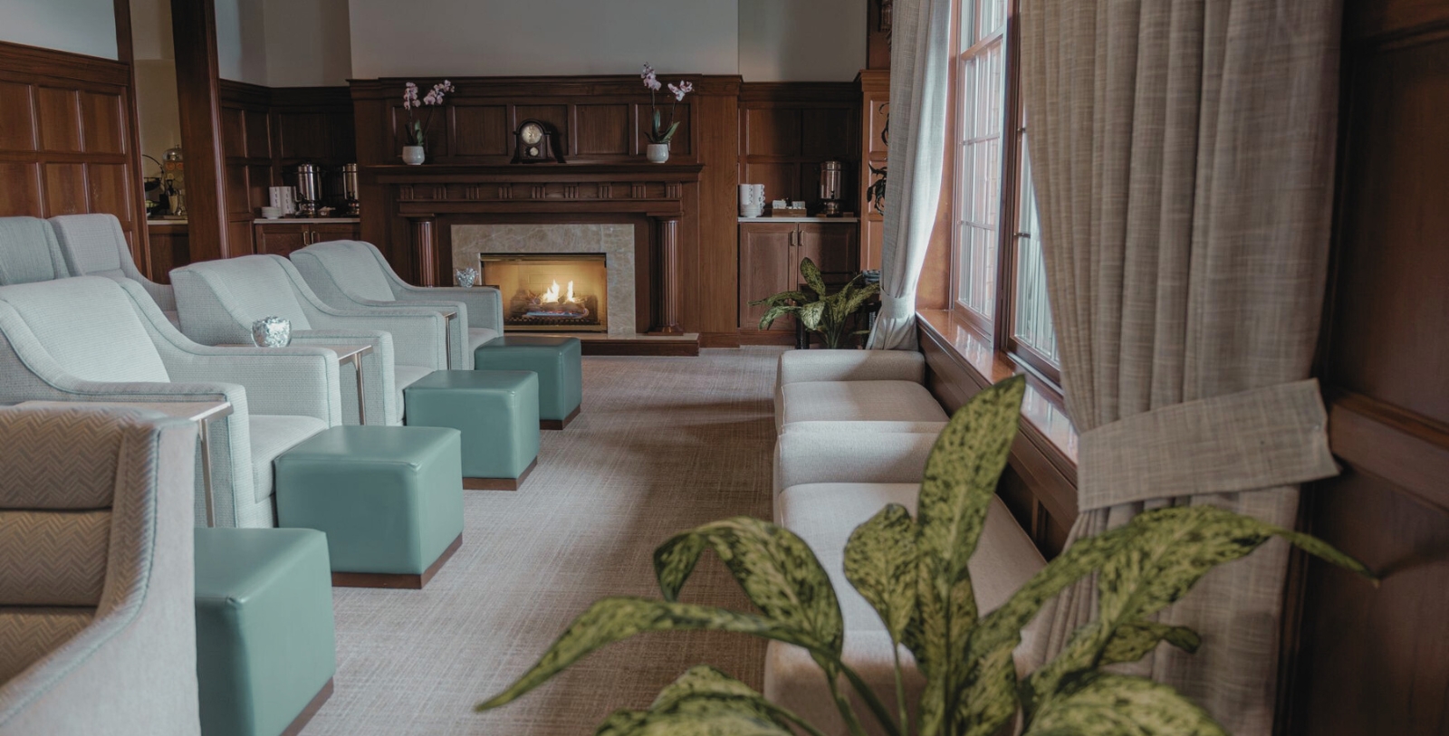 a room with a fireplace and couches