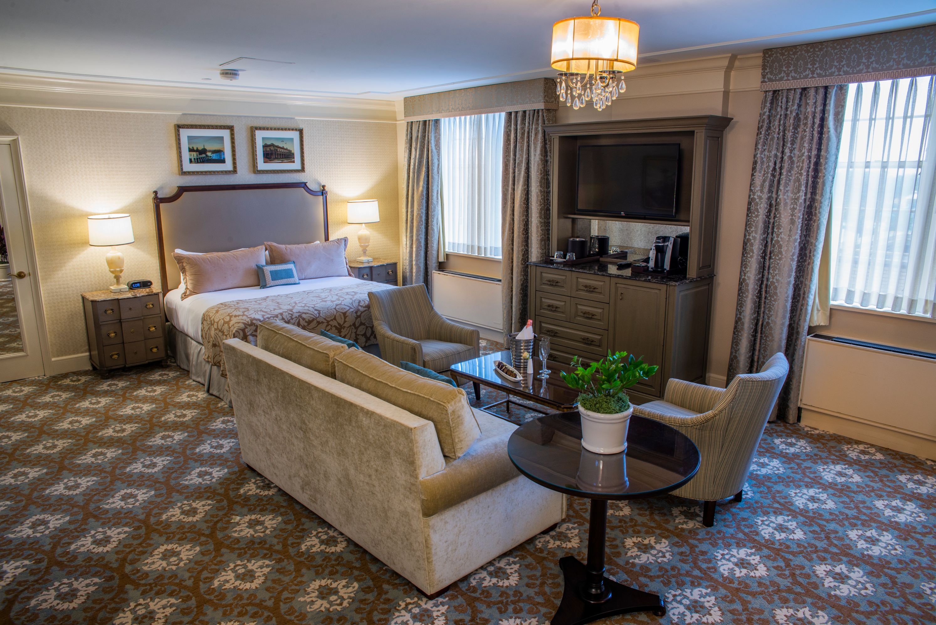 a room with a bed and a television