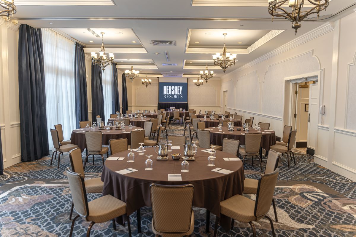 a room with round tables and chairs
