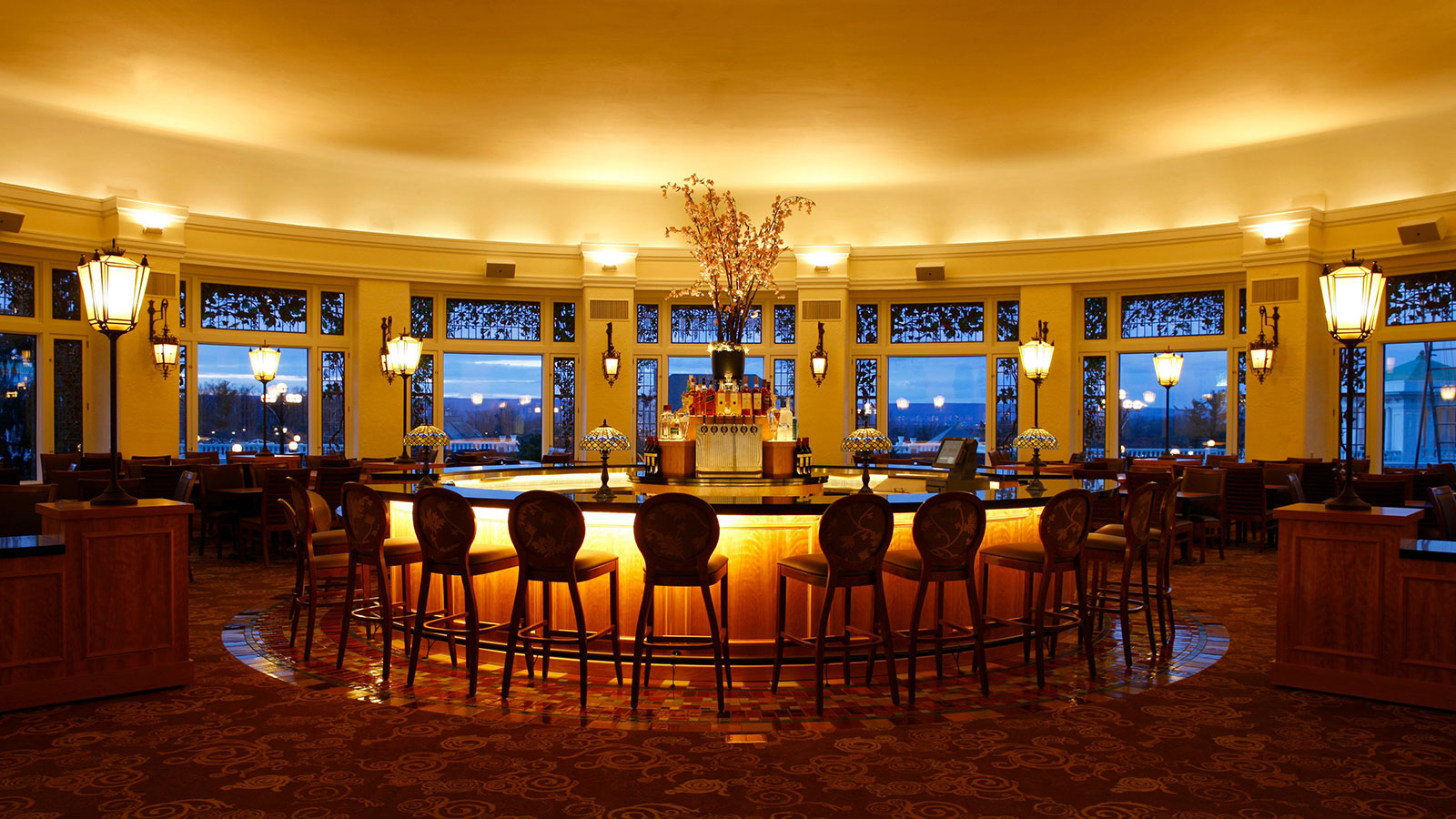 a large round bar with chairs around it