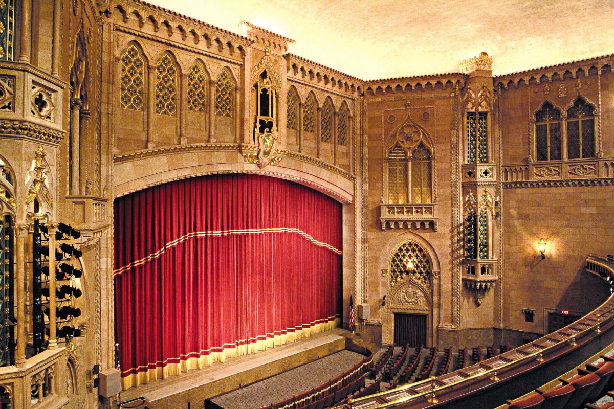 a theater with a red curtain