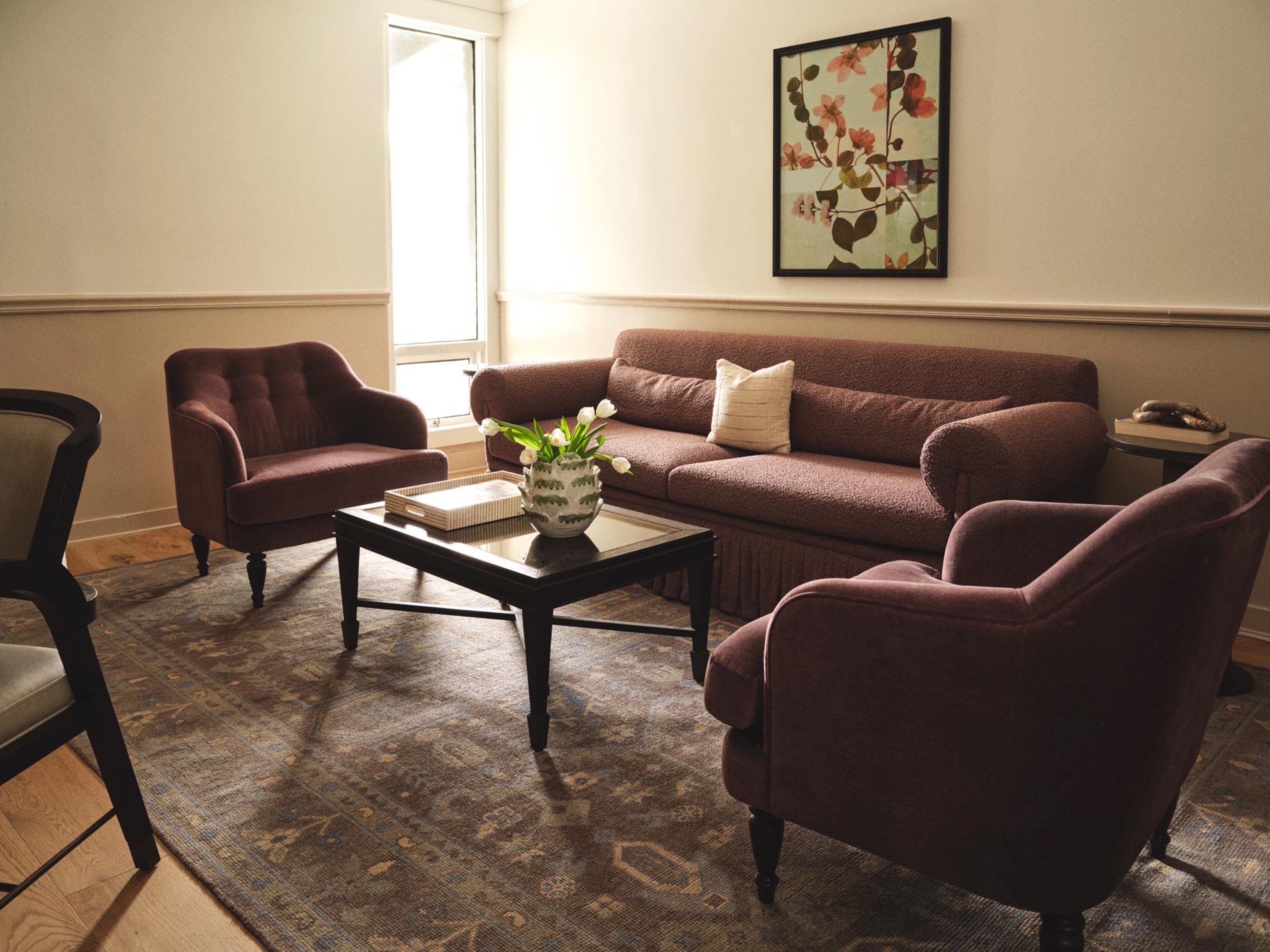 a living room with a couch and chairs