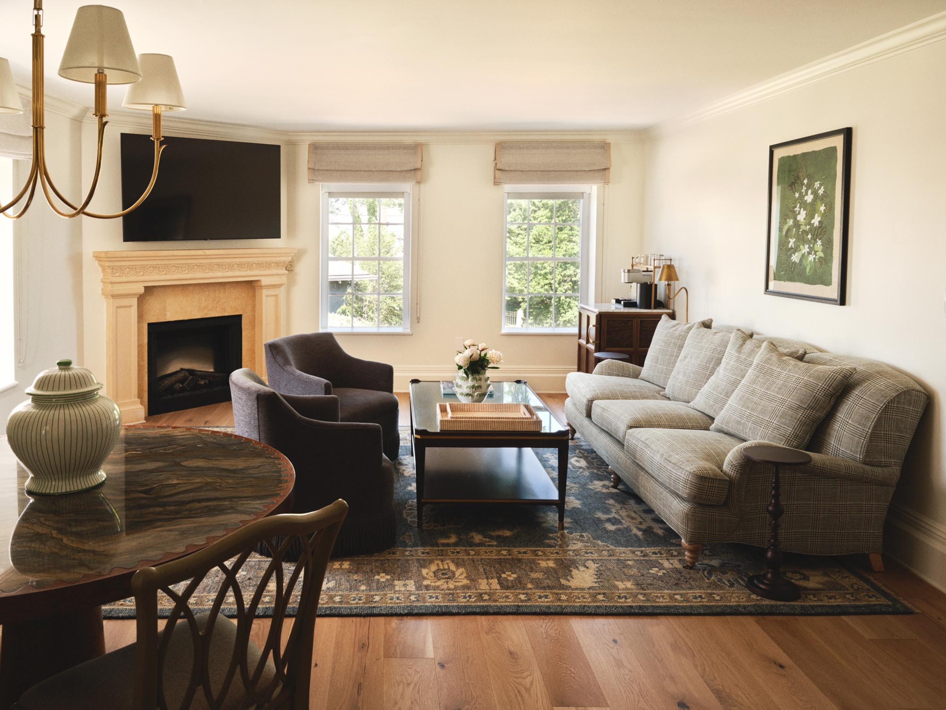 a living room with a fireplace and couches