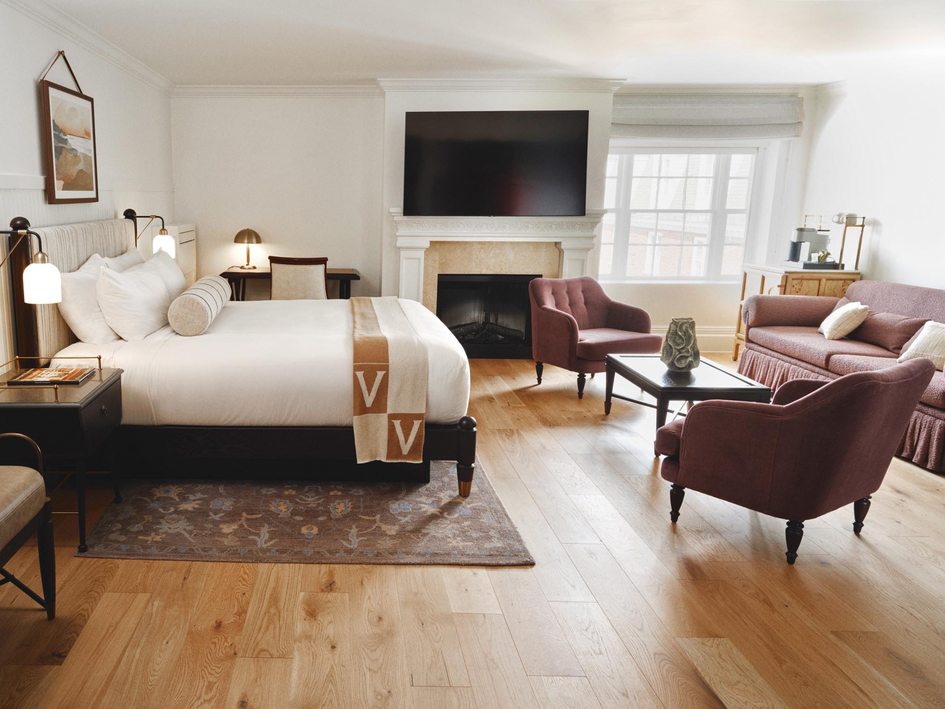 a room with a fireplace and a bed