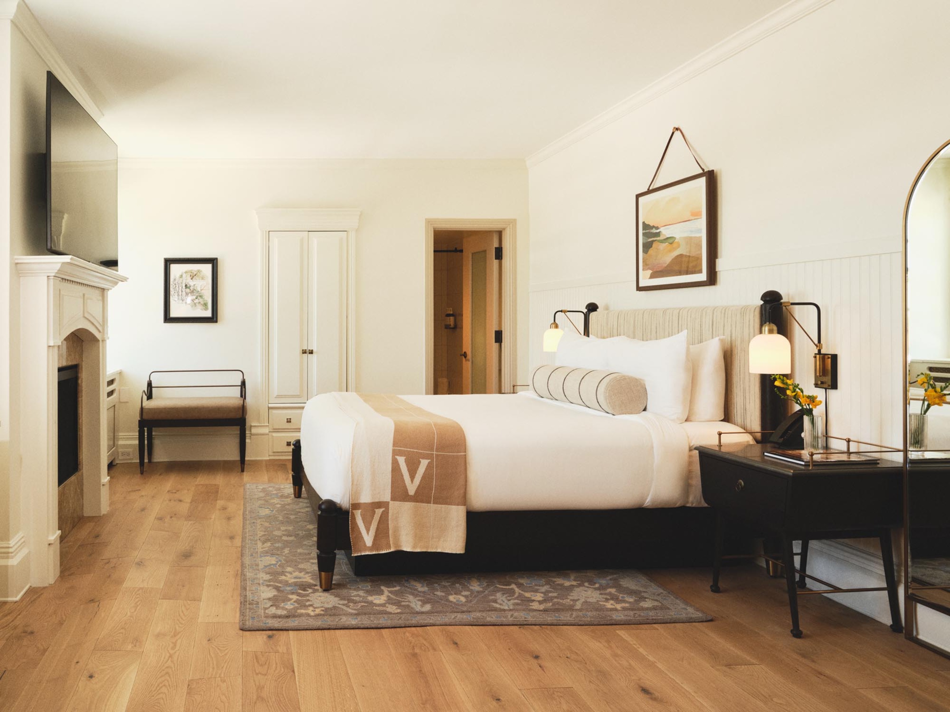 a bedroom with a bed and a table