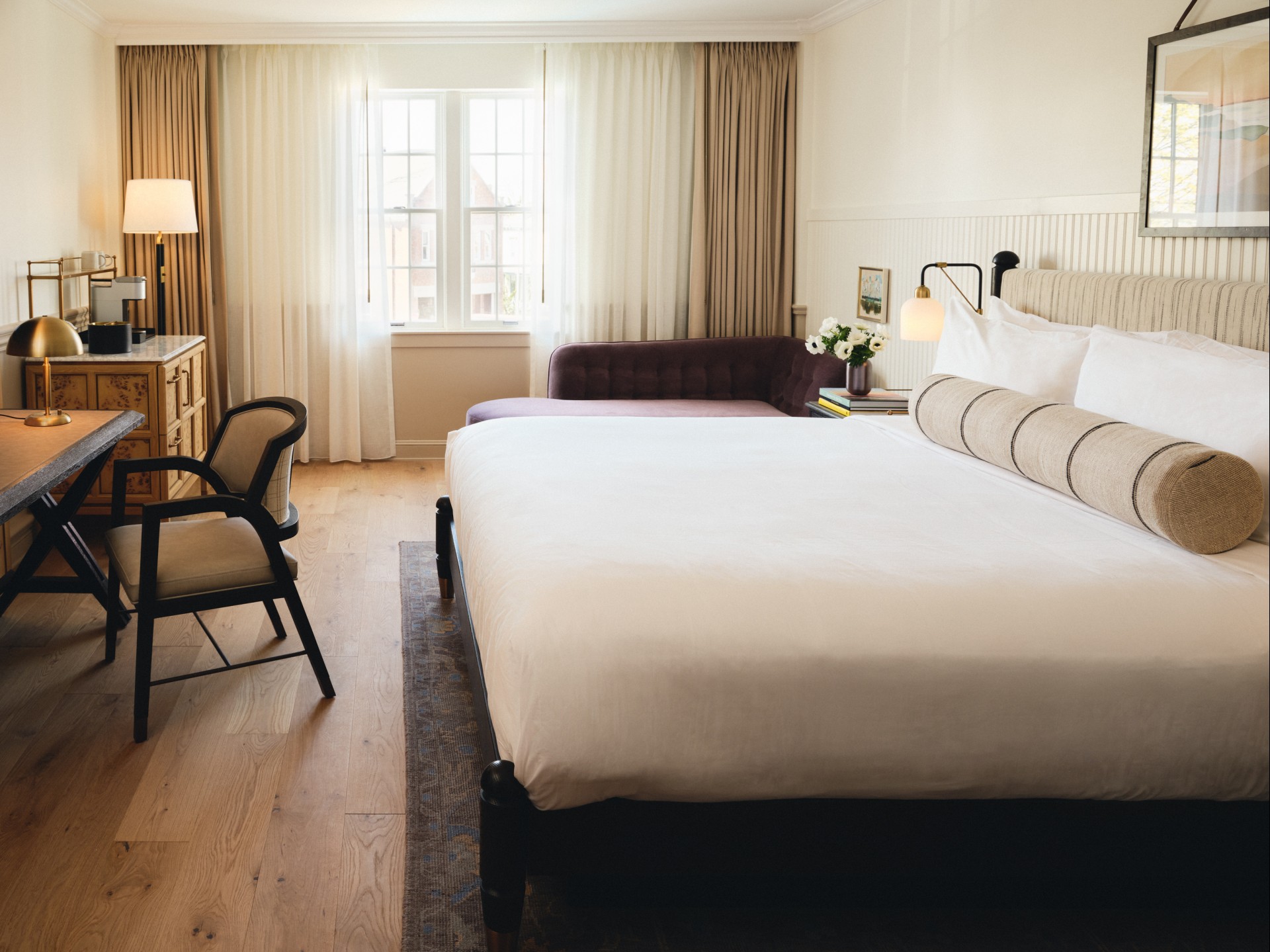a room with a bed and a chair